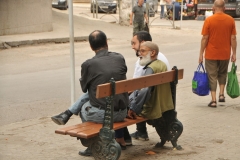 Algiers is the capital and largest city of Algeria. The city's population in 2020 was estimated to be around 4,500,000. Algiers is in the north-central part of Algeria.  Arab and French are the main languages spoken.  Here we have 3 men having a conversation on a bench.