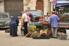 Here we find a pop up fruit and vegetable stand in a local neighborhood just off a main road.