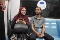 A young couple seated across from me