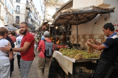 Just a normal morning of people going about their grocery shopping in the Casbah. Houssem, our guide,  helping one of our group.