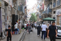 Great street shot. Laundry hanging off the buildings above.