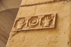 Interesting items on the wall. I know it had a meaning and did not find out.    Maybe hands off???