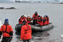 Close up of a group arriving by zodiac from the ship.