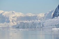 It does not look it but the ice fields in the photo at water level are thousands of feet high.