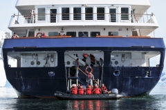 Great shot of the aft of the ship. The zodiac unloading passengers to the bottom deck. This is the area where we had our boots and water repellent pants pressured washed. The next deck up the stairs is where we stored our boots and pick up our walking shoes into the ship.