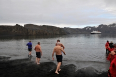 Second from left I am walking into the frigid water