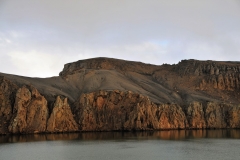 Departing Deception Island. A photo of some of the strata of the earth in the volcanic caldera.