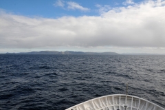 First light of morning on the last day at sea viewing the bottom of the world as we know it, Tierra del Fuego, and the tip of South America. Having survived the rough seas of the Drake Passage now entering the Beagle Channel.
