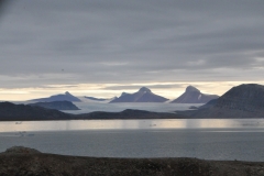 Massive glaciers in the distance across the bay
