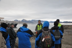 Our group learning of Ny-Alesund, the history and information from our expedition leaders from on board our ship.