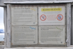 Rules and regulations for Ny -Alesund.   As a visitor in Ny-Ålesund, there are some rules one needs to be aware of: In the settlement and in a surrounding radius of 20km around Ny-Ålesund there's radio silence, meaning wifi and bluetooth must be turned off on mobile phones and other units. It's not allowed to use drones or other equipment, cameras, wristwatches etc., with  WiFi turned on. This is due to The Norwegian Mapping Authority's  geodetic station just outside of the settlement which measures the earth's movements with very finely tuned and delicate instruments.