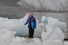 The ice is huge that has  broken off of the nearby glacier and washed on shore.