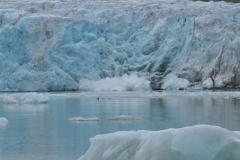 All of a sudden we see calving of the ice beginning from the glacier. Ice falling into the water in front of us.