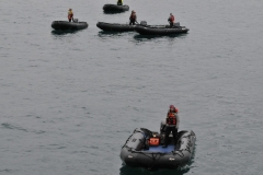 Zodiacs and expedition leaders waiting for their groups to load for a new location landing.