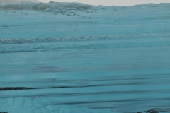 In the stillness of the Arctic we floated past this mass of blue ice.