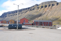 View of apartments in the foreground and in the hills the former coal mining camps remnants still on the hillside above the town.
