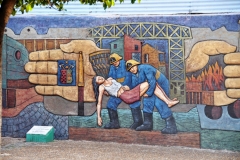 A colorful art mural on a wall nearby.