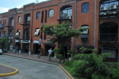 Shopping Centers with shops and restaurants back up to the harbor.