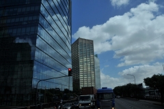 The clouds reflecting onto the glass on the new buildings.