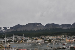 City of Ushuaia a casino in the foreground next to the harbor. ,