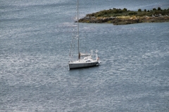 Lone sailboat in the waterway inside the Tierra del Fuego National Park.