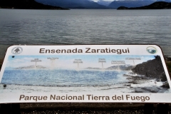 Sign pointing out the different peaks in the distance.