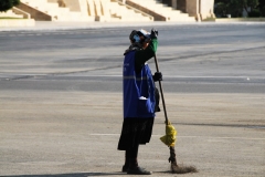 The old and the new of Azerbaijan. Here we have a lady sweeping the streets of the city.