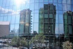 Reflections of nearby buildings in the Flame Tower buildings.