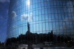The cost of Flame Towers was an estimated US$350 million. Construction began in 2007, with completion in 2012..The clouds and the sky reflecting in one the Flame Tower buildings.
