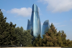 Flame Towers in the distance. At night many colors appear on the buildings.