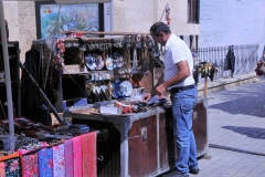Local shops and venders along the street display many items made locally.