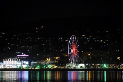 A ferris wheel alongside the harbor for entertainment