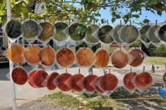 Local fruits pressed and drying in the sun and then for sale to tourists and locals. .