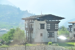 Typical home with the roof raised above the house for ventilation.