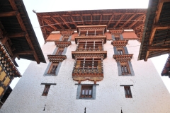 Looking up from a courtyard at the ornateness of the buildings