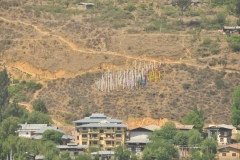 View of the valley with Prayer flags in the distance blowing in the wind
