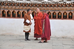 Local to the left speaking with two Monks