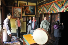 Tashi showing us several rooms inside the home
