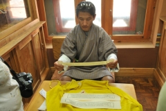 Tashi explaining the Ancient Bhuddist Manuscript in his hand