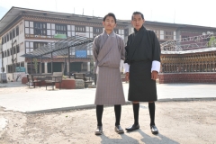 Tashi Dorji, our country guide, and our driver Ghembo. What they are wearing is the traditional clothing worn by the majority of all men in the country of Bhutan. Inside the cloth flap you see from the neck to the waist at a 45 degree angle across the front chest area of the body is an area to put wallet, cell phone and anythng else they may need to carry. There are no pockets.