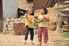 Young girls playing with their dolls