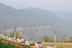 East road dirt single lane highway betwen Thimphu and Punakha in the distance