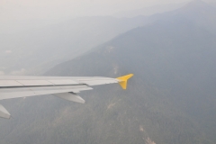 Flying through a valley between two mountains out of Bhutan. What an incredible experience to have visited Bhutan. Bhutan is playing catch up with the rest of the world. Television and many of the items we take for granted are just being introduced into Bhutan. The people of Bhutan could not have been more hospitable. I made so many new friends during our stay in Bhutan. It is defintiely a hidaway from the busy world today. I leave with many wonderful memories of a beautiful country and friendly people.