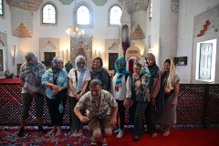 Our local guide inside the mosque explaining some of the rituals to the ladies in our group. 