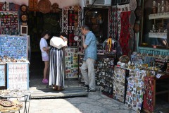 You find artisans creating intricately designed copper and silver products like coffee pots, jewelry, and decorative plates. This craft has a long-standing history in the city, blending Ottoman influences with modern artistry to produce unique, handcrafted souvenirs and functional items.  