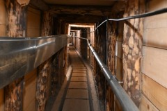 At first the tunnel was a simple, muddy path through which supplies had to be carried by hand or on the backs of soldiers. Less than a year after it was created, however, a small railway track was laid and small carts were built to transport supplies through the tunnel. The final construction of the tunnel included a  power cable, pumps for pumping underground water, an oil pipe and permanent lighting.