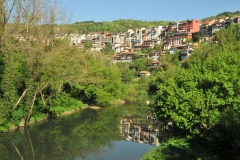 Veliko Tarnovo is a city in north central Bulgaria and the administrative centre of Veliko Tarnovo Province.  Often referred to as the "City of the Tsars", Veliko Tarnovo is located on the Yantra River and is famously known as the historical capital of the Second Bulgarian Empire, attracting many tourists with its unique architecture. The old part of the city is situated on the three hills Tsarevets, Trapezitsa, and Sveta Gora, rising amidst the meanders of the river Yantra.