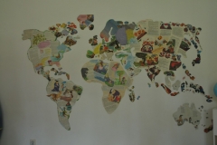 A hand made map of the world teaching the students about world geography.