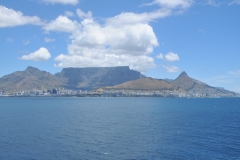 Arriving in Cape Town, South Africa, December 5, 2022,  from Namibia after 3 days at sea.  This is the last port in our trip from Lisbon, Portugal to Cape Town.   Table Top Mountain in the distance with the clouds about it make it striking  welcoming photo. Table Top Mountain in the distance with the clouds about it make it striking  welcoming photo.  The lower flat hill to the right is signal hill where we have a sunset party this evening.  To the right of this is Lions Head.