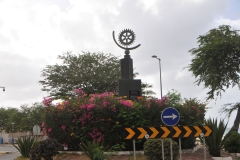 Rotary insignia along the highway in town.